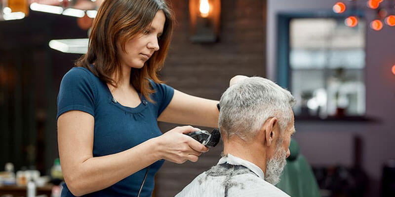 Hair stylist cutting hair