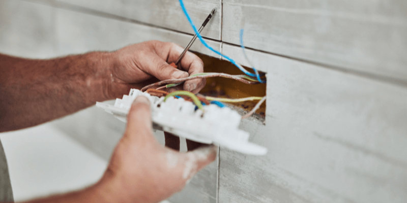 Electrician installing light switch