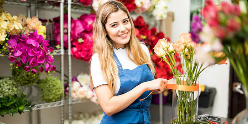 Employee at florist shop that has business insurance coverage 
