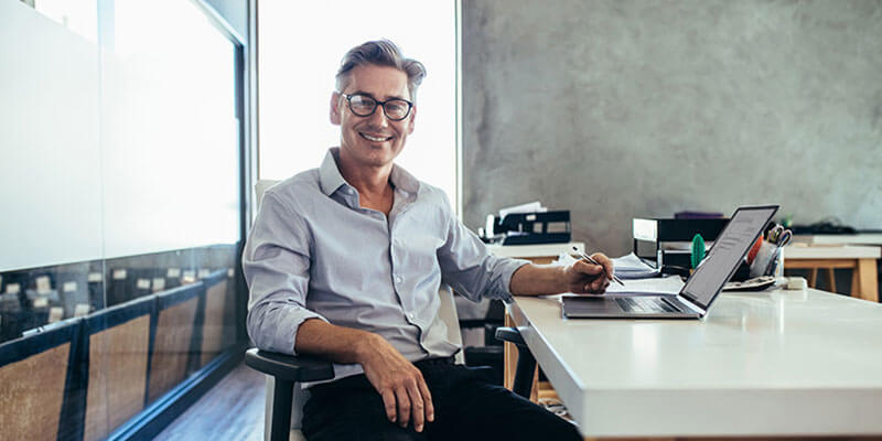 Business owner sitting at desk