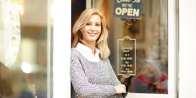 Entrepreneur holding an open sign