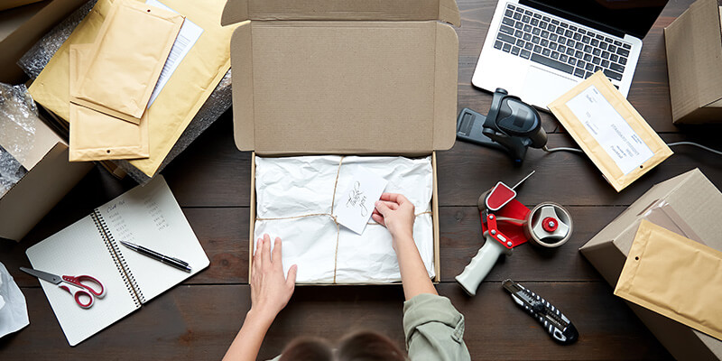 Employee packaging a shipment of products