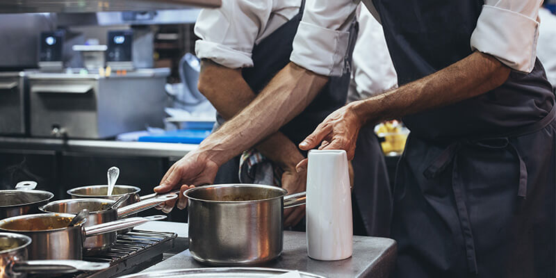 Restaurant employees working in a kitchen