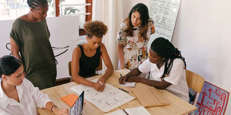 Employee meeting at start-up business discussing plans