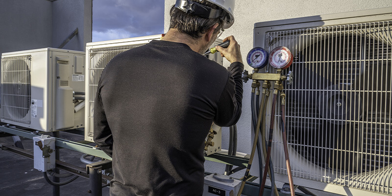 HVAC technician working at a commercial business