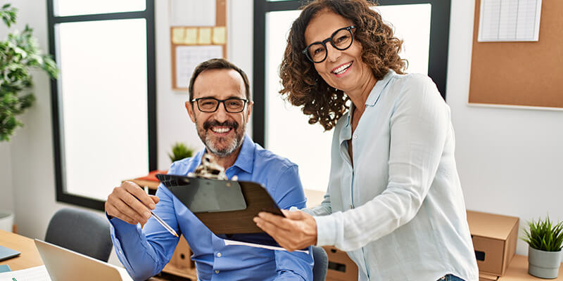 Two people working together at a business